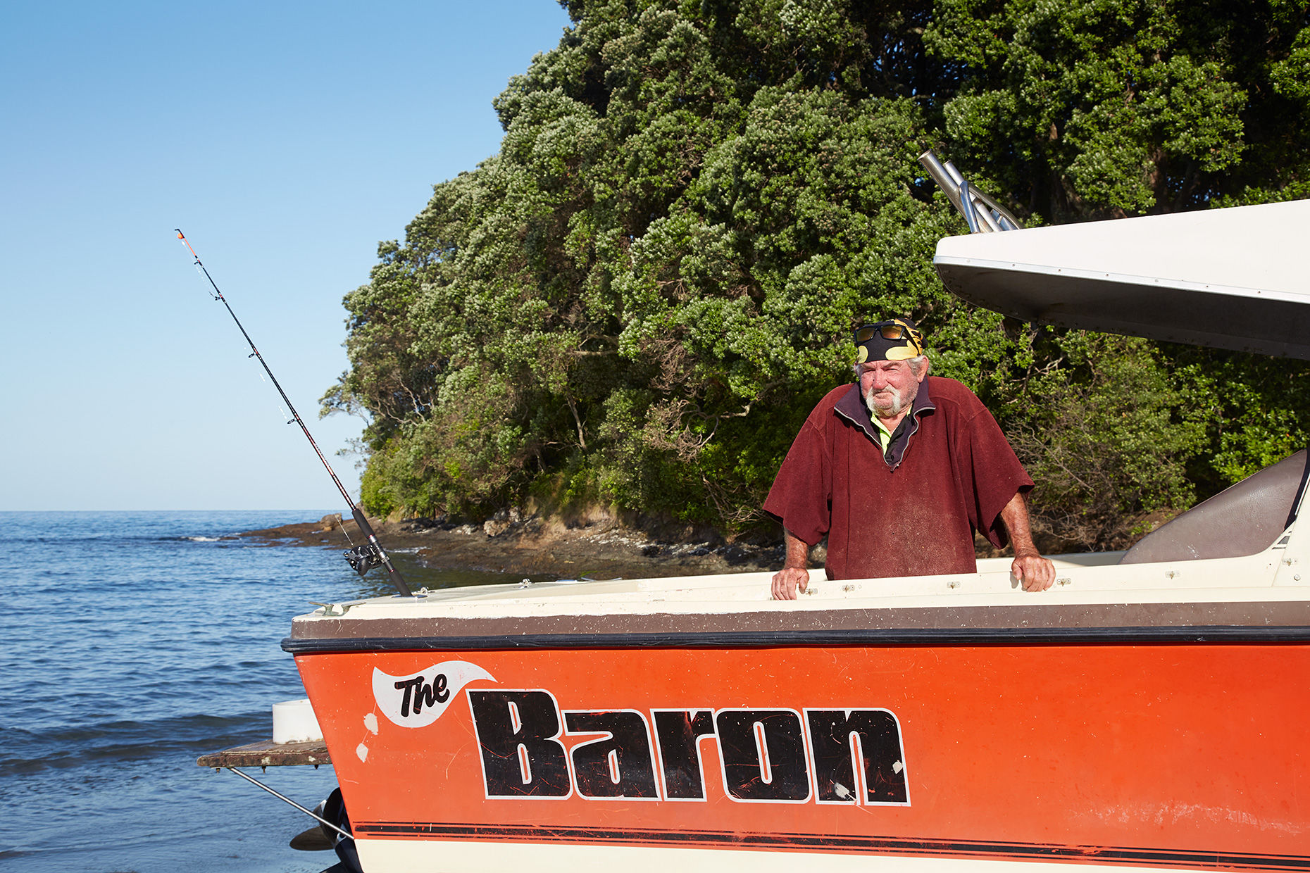 Man in boat, Te Kaha, New Zealand, 2020